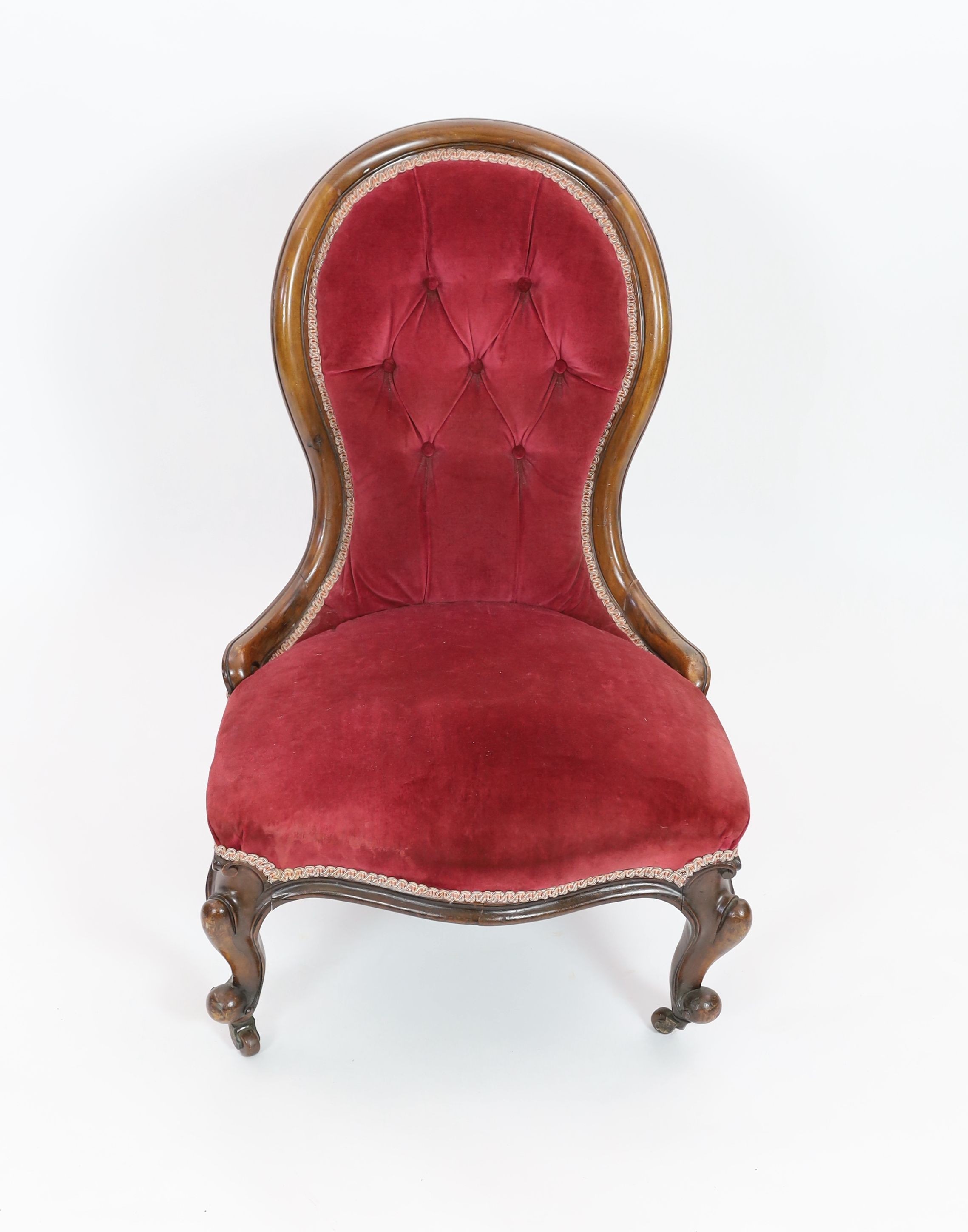 A Victorian walnut spoonback nursing chair, width 60cm depth 54cm height 92cm